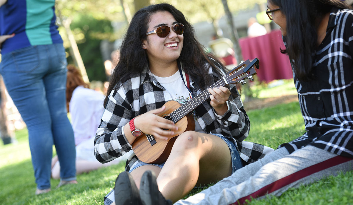 Student playing ukulele