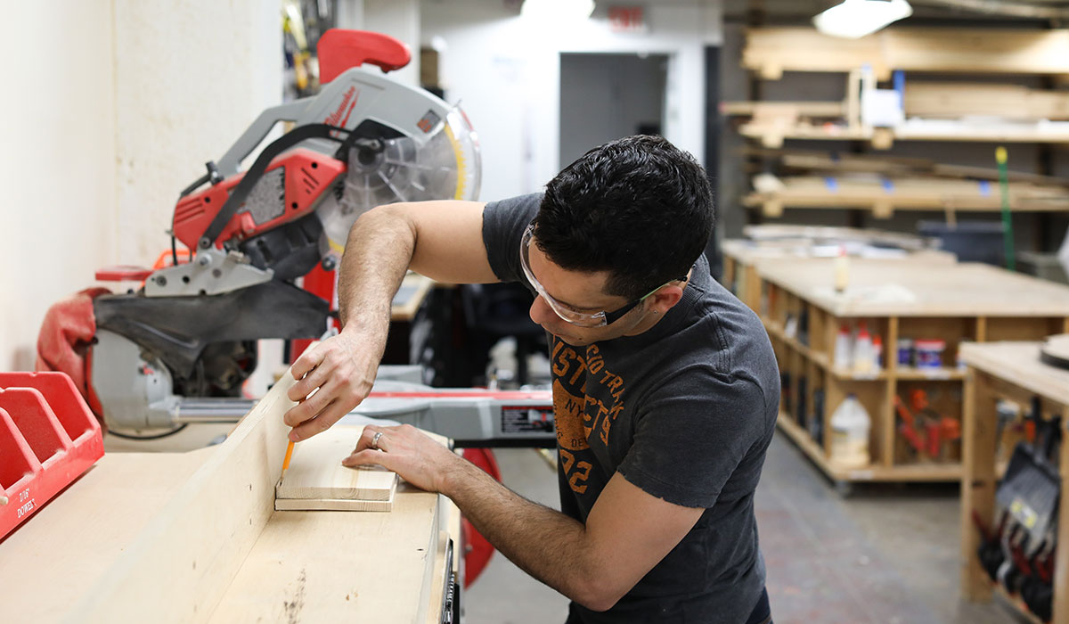 Student cutting wood