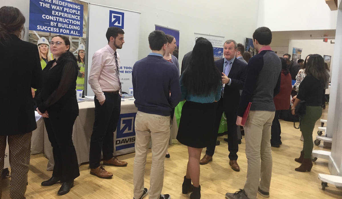 students talk to employers at the AIAS career fair