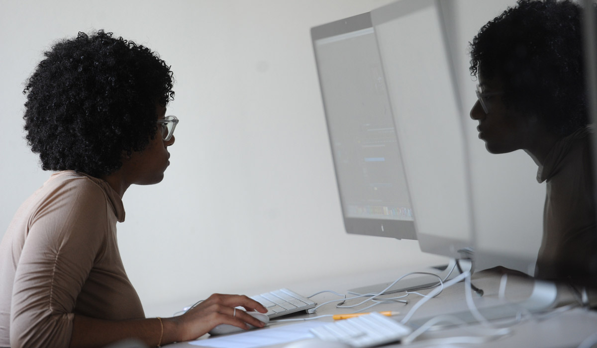 Diverse Digital Art Catholic University student in computer lab